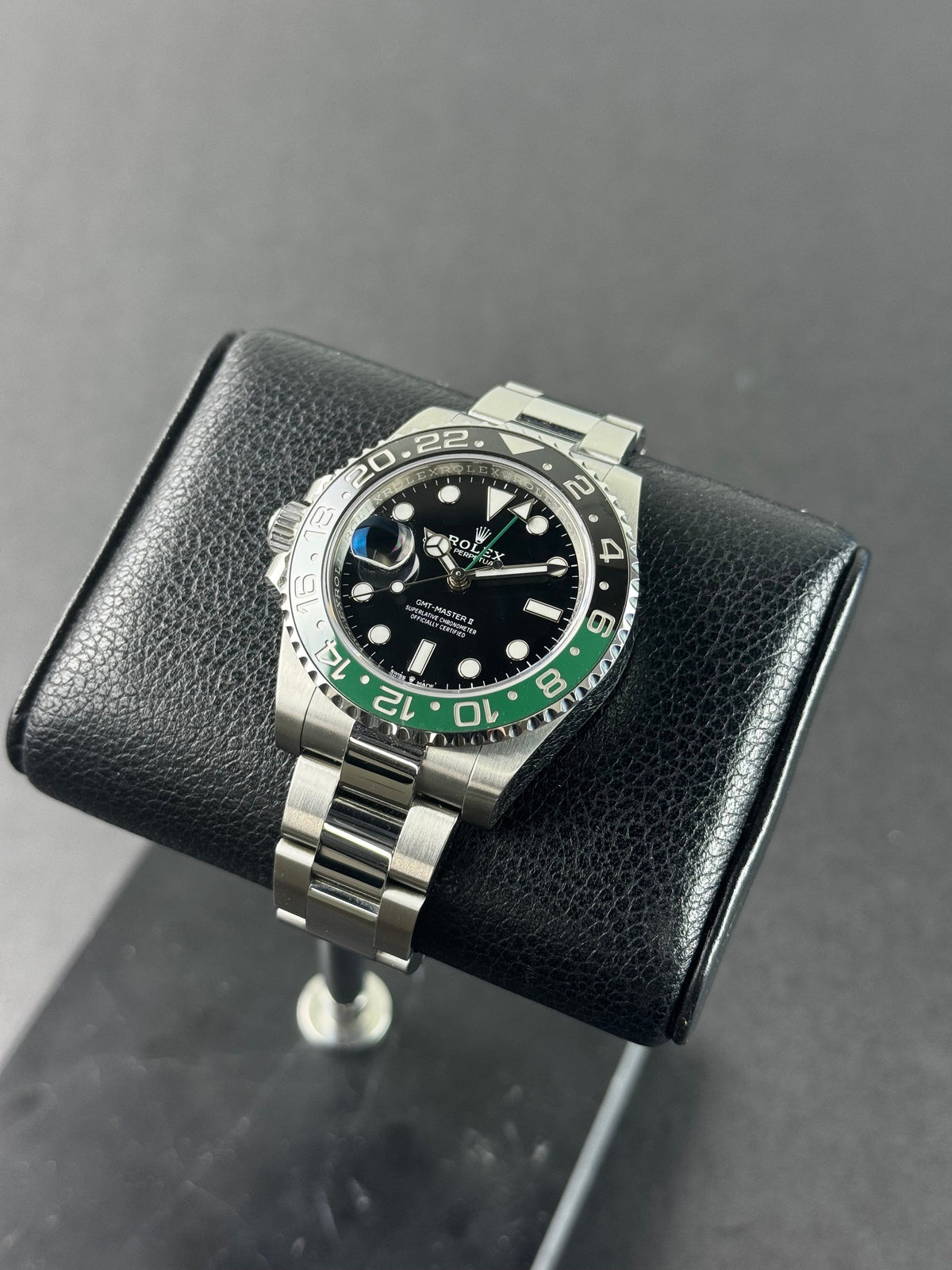 Rolex GMT-Master II Sprite with a green and black bezel and left-hand crown