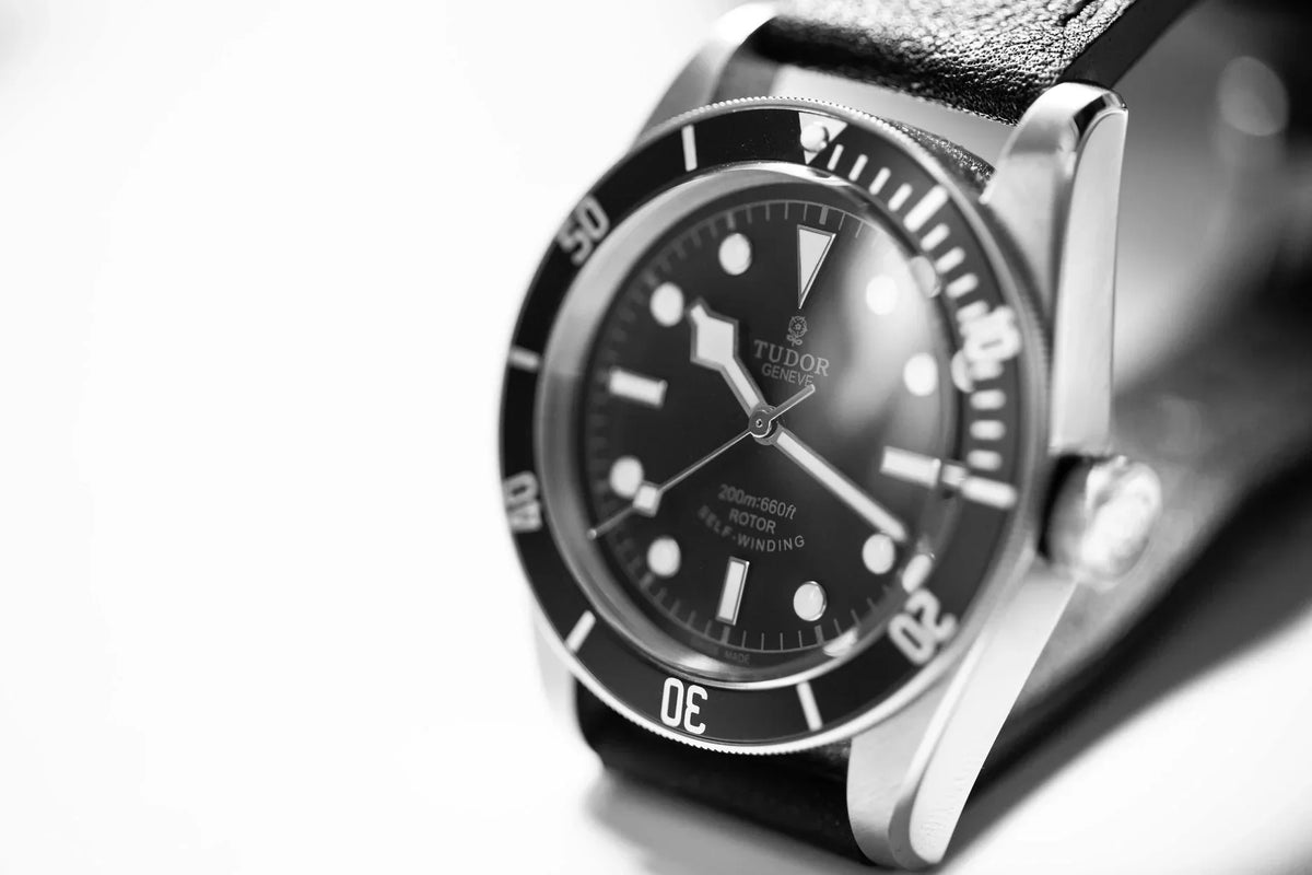 Black-and-white close-up of a Tudor Black Bay watch